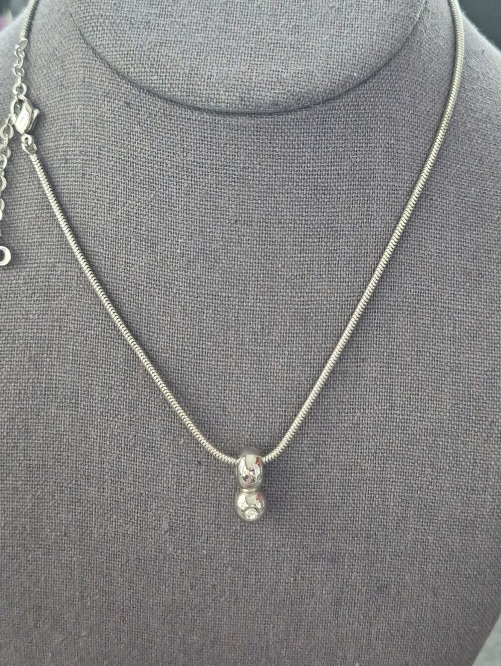 Christian Dior tagged necklace Silvertone, Figure 8 Pendant On Snake Chain